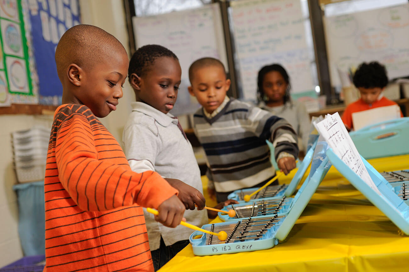 Kids playing xylophones